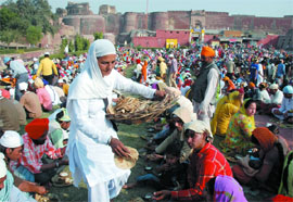 Langer being served on the occasion of Gurpurab at Gurudwara Kila Mubarak in Bathinda on Saturday.