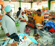 Farmers buying clothes at Haryali store near Maur Mandi in Bathinda on Saturday.