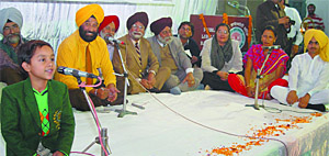Aaryan Bhardwaj, a student of class I, performing at Kavi Darbar and Mushaira held in Bathinda on Sunday.