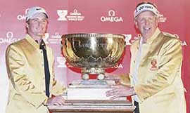 Scotland�s Marc Warren (L) and Colin Montgomerie hold the trophy after winning the World Cup golf tournament in Dongguan, China, on Sunday. 