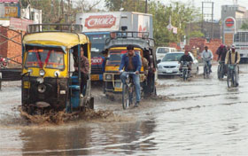 Waterlogging after late-night showers gave commuters a harrowing time on Friday.