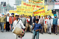 A drum-beater leads the AIDS awareness rally in Bathinda