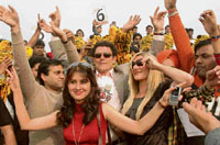 Mike Whitney, former Australian cricketer (dark glasses), joins spectators in cheering players during the ICL match between Kolkata Tigers and Chennai Superstars in Panchkula on Saturday.