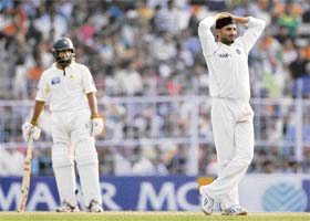 Harbhajan Singh reacts as Mohammad Yousuf looks on during the fifth and final day of the second Test match in Kolkata
