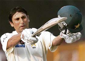 Pakistani cricket captain Younis Khan acknowledges the crowd after reaching a century during the last day of the second Test between India and Pakistan at the Eden Gardens in Kolkata