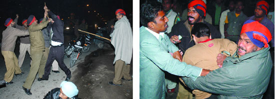 Policemen trying to calm down those involved in the brawl on Goniana Road on Wednesday night.