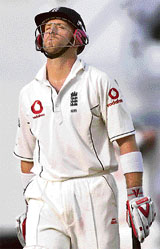 Dejected England batsman Matt Prior leaves the ground after he was dismissed by Muttiah Muralitharan during the fifth day of the first Test match at Asgiriya Stadium in Kandy on Wednesday.