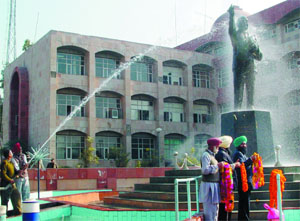 Firemen giving a jet bath to the statue of B.R. Ambedkar in Bathinda on the occasion of his death anniversary on Thursday.