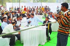 Amount of bid being discussed among the bidders during PUDA land auction in Bathinda on Friday