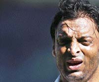 Pakistan's Shoaib Akhtar reacts as he walks out of the field during the first day of the third and final Test cricket match against India in Bangalore on Saturday.