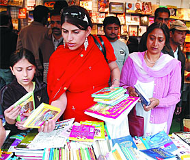 Visitors having a look at the books on the last day of the Bathinda Book Fair on Sunday.