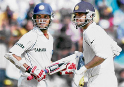 Sourav Ganguly (left) and Irfan Pathan cross each other for a run during the second day of the third Test match between India and Pakistan at Chinnaswamy Stadium in Bangalore