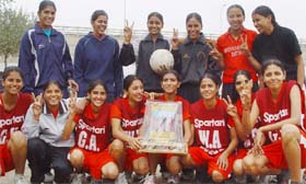 The Bathinda team that won the state-level senior netball championship, organised at Khalsa Senior Secondary School, pose with the trophy
