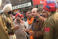 Police officials with Shiv Sena activists before their detention in Bathinda on Wednesday. 