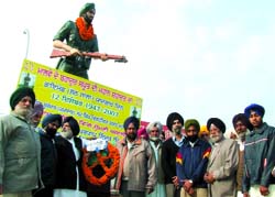 Members of the ex-servicemen wing of Shiromani Akali Dal paying tributes at the statue of Jemadar (Naib Subedar) Nand Singh in Bathinda on Wednesday.