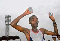 Kenyan athlete Ngirnyaga cools off after winning the 42-km full marathon as part of the BSNL Bangalore International Marathon at Kanteerva Stadium in Bangalore on Sunday.