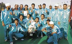 The Punjab Police team, which won the 56th All-India Police Hockey Championship, in a jubilant mood at the Surjit Hockey Stadium in Jalandhar on Sunday. 