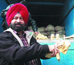 Civil surgeon Maninderjit Singh showing the seized jaggery on Tuesday.