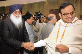 Chief Minister Parkash Singh Badal shakes hands with finance minister P. Chidambaram at the 54th meeting of the National Development Council in New Delhi on Wednesday.