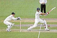 Rahul Dravid plays a shot on the first day of the warm-up match against Victoria at the Junction Oval in Melbourne. 
