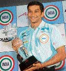 Narain Karthikeyan holds the A1 Grand Prix trophy during a felicitation ceremony in New Delhi on Thursday.