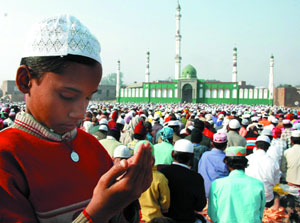 Pious moment: On the occasion of Id-ul-Zuha, a child worships at a mosque in Bathinda on Friday.