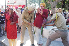 Artistes of the Narinder Kala Manch, Faridkot, enacting a nukkad play, �Injj Ni Vasde Vehre� at the civil hospital in Bathinda on Saturday.