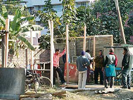 Illegal kiosks being erected outside the District Courts complex in Amritsar on Saturday.