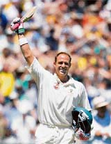 Matthew Hayden acknowledges the crowd after scoring his century on the first day of the first Test between India and Australia in Melbourne on Wednesday.