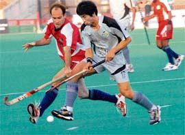Kim Chul (R) of Orissa Steelers and Joost Van Den of Chennai Veerans vie for the ball during their Premier Hockey League match at Hockey Stadium, Sector 42, in Chandigarh on Wednesday. 