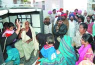 The protesting women and children being taken to the police station from the municipal corporation office in Bathinda on Friday. 