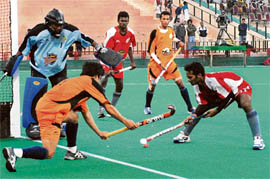 You Hyo-Sik (L) of Bangalore Hi-Fliers tries to stop a Chennai Veerans player
