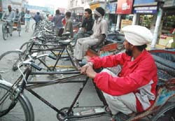 The wait seems to be a long one for rickshaw-pullers outside the Bathinda railway station as people are rushing to catch trains to be with their family members for the New Year celebrations. 