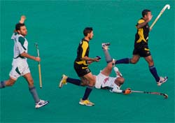 Viren Rasquinha of Maratha Warriors falls during the PHL match against Chandigarh Dynamos at the Sector 42 Hockey Stadium in Chandigarh on Sunday.