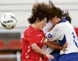 HEAD-ON COLLISION: The ball was supposed to be their target, <p>but it somehow eluded both players during a FIFA Women�s World Cup soccer match in China