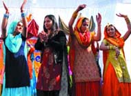 Excise and Taxation Officer, Sanjita Tiwari (second from left), joins the students of Swami Vivekananda Girls College, Bathinda, in the New Year celebrations on Tuesday. 