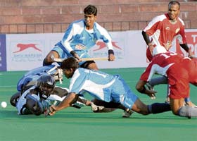 Chennai Veerans goalkeeper tries to stop the ball during a match against Hyderabad Sultans at PHL match