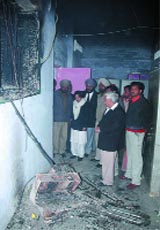 The district and sessions judge inspecting the site of fire.