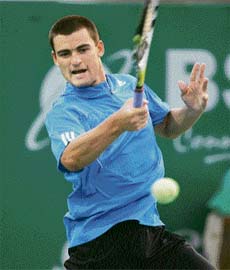 Russian Mikhail Youzhny hits a return to his French opponent Edouard Roger-Vasselin during their second round match at the ATP Chennai Open in Chennai