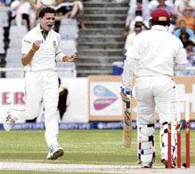 Dale Steyn (L) celebrates the dismissal of Daren Ganga during the first day of the second Test between South Africa and West Indies at Newlands cricket ground in Cape Town