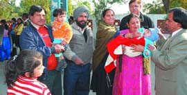 A child being administered polio drops at a railway platform as a passenger train halted in Abohar on Sunday.