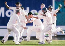 Australian teammates celebrate their victory over India at the Sydney Cricket Ground on the last day of their second cricket Test on Sunday. Australia won the Test to equal the world record of  16 consecutive Test victories.