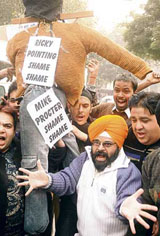 Cricket fans raise slogans in protest against the ban on Harbhajan Singh in New Delhi on Monday.