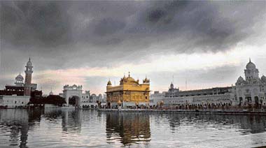 Dark clouds hover over the Golden Temple on Tuesday. 