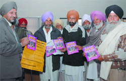 SDM K.P.S. Mahi (extreme left) informing the farmers about the ways to tackle the Mealy bug in Bathinda