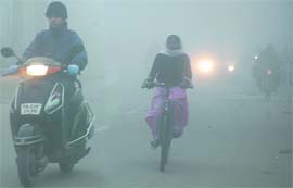 Fog Hog: Commuters had a difficult time riding through the city as fog engulfed Bathinda on Friday morning.