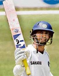 Dinesh Kaarthick celebrates after scoring a half century during the three-day cricket match against Australian Capital Territory (ACT) XI in Canberra. Kaarthick was unlucky to miss a century, losing wicket on 97. 