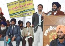 Sukhbir Singh Badal, the acting president of SAD (B), addressing a gathering at Chaina village in Faridkot district on Monday. 