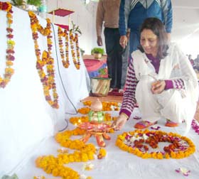 Art of living teacher Meenu Chandra lights a lamp to mark begining of the camp at BSF sector HQ in Abohar on Monday.