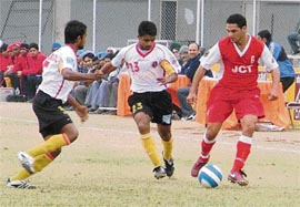 Baljit Singh Sahni (R) of JCT vies for the ball during the match against East Bengal in the ONGC  I-League played at Guru Nanak Stadium in Ludhiana on Monday.